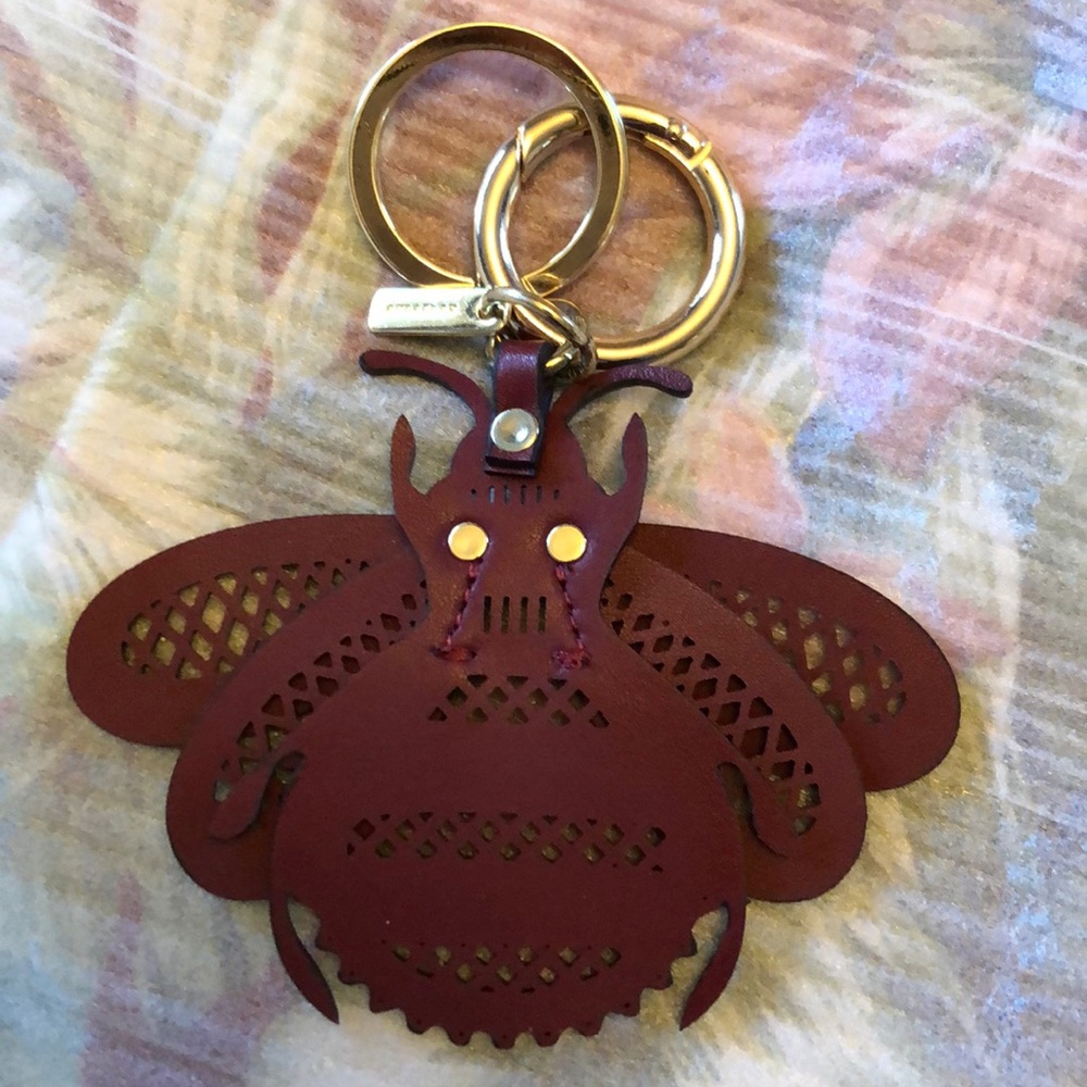 Burberry burgundy laser-cut leather bee key charm
